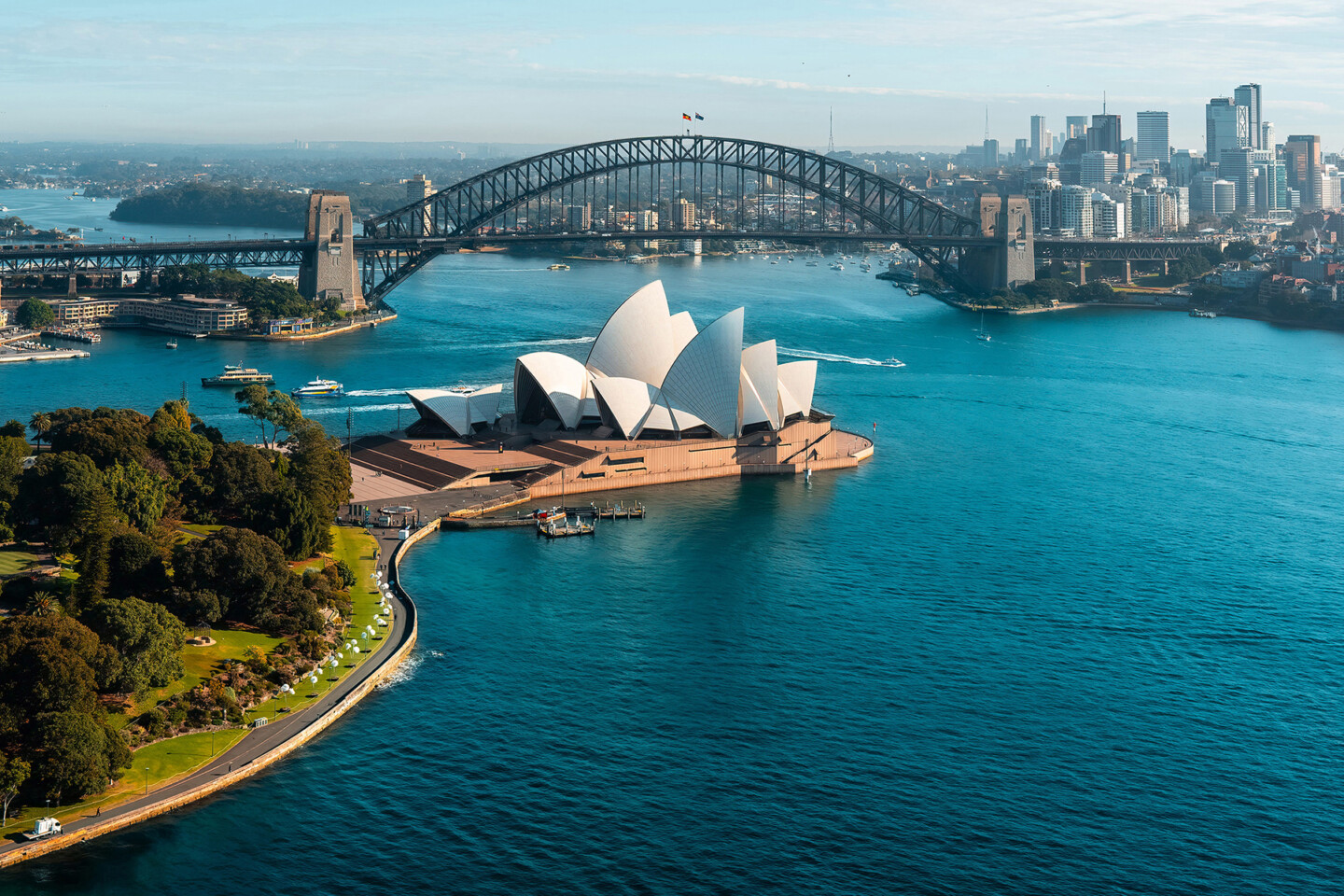 Sydney-Australia-NSW-View-of-Sydney-Harbour-with-the-Royal-Botanic-Gardens-iconic-Opera-House-and-Sydney-Harbour-Bridge-USAGEONCE-©Tourism-Australia-1093537-EXPIRES-10.11.20260.jpg